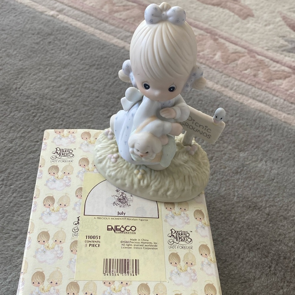 Precious Moments July Figurine.